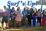 Surf Ranch Manager Sam Ramirez gets the royal welcome from Lemoore Chamber of Commerce officials and local dignitaries Tuesday at the local man-made surfing facility.